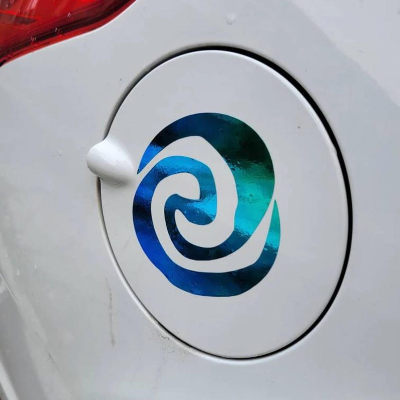 May include: A white car with a blue and green swirl sticker on the gas cap.