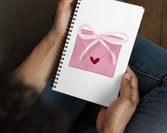 Isabella's share kindness letter artwork on a spiral notebook