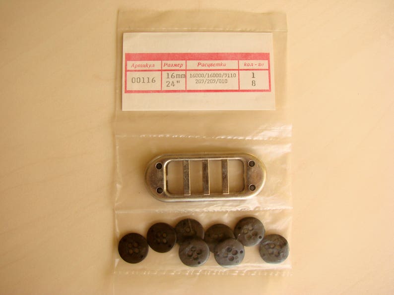 May include: A silver metal vent cover with four slots. The vent cover is packaged in a clear plastic bag with a white label that reads "Артикул: 00116, Размер: 16mm, 24", Расчетный: 16000/16000/9110, 207/207/01D, Код - 60: 1, 8". The bag also contains eight small black round buttons.