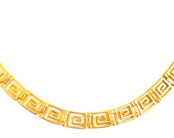 May include: A gold chain necklace with a geometric pattern. The chain is made of interlocking squares.