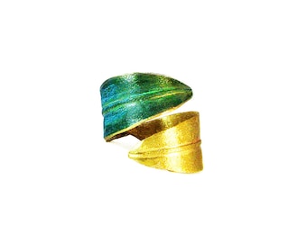 May include: A gold and green leaf-shaped ring. The ring is made of metal and has a textured surface.