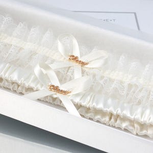 Ivory Wedding Garter Set: Lace and Tulle with Gold Charm, Keepsake and Toss Options