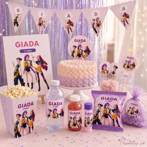 May include: A party set featuring the name GIADA 5 ANNI, including a cake topper, popcorn box, water bottle, juice bottle, bubble wand, snack bag, and favor bag, all decorated with illustrations of three animated characters in colorful outfits.
