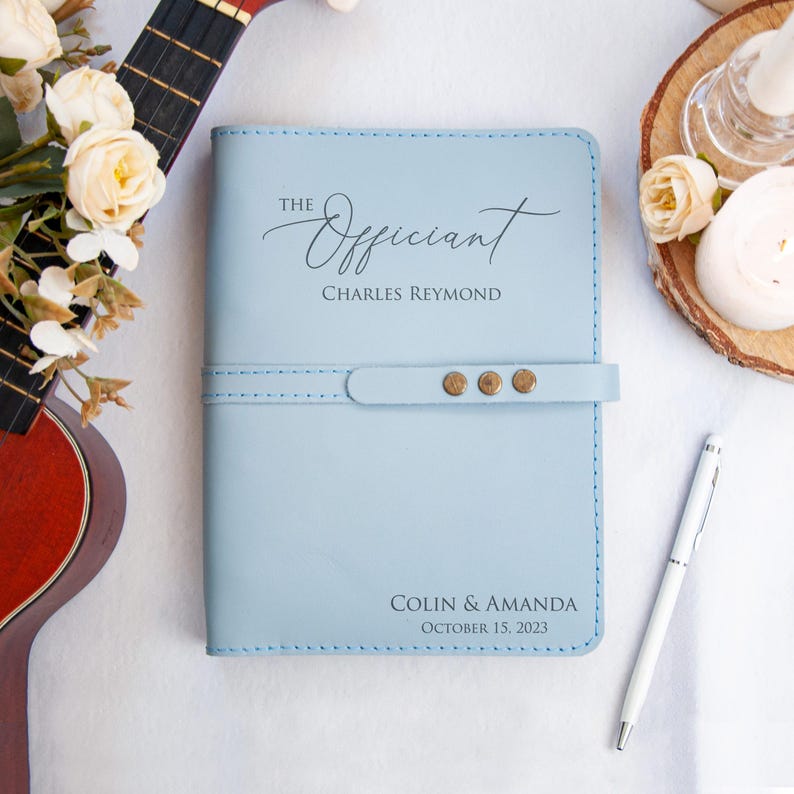 a note book with a pen on top of it