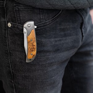 a person with a pocket knife in their back pocket