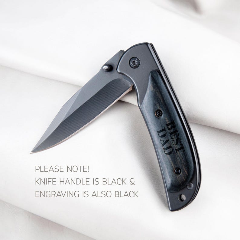 a knife that is laying on a white sheet
