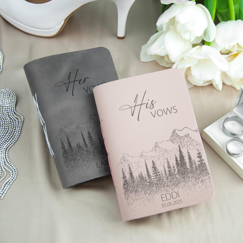 a couple of notebooks sitting on top of a table