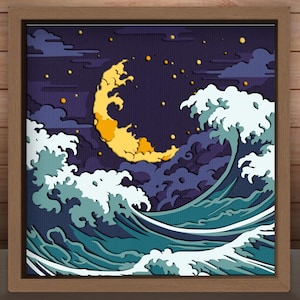 May include: A framed art print featuring a stylized depiction of a crescent moon, waves, and clouds. The artwork uses shades of blue, teal, and yellow. The frame is a light brown color. The image includes the text "9 LAYERS".