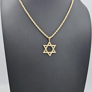 May include: A gold chain necklace with a Star of David pendant.