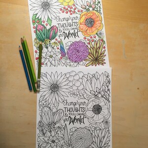 May include: Two floral coloring pages with the text "change your thoughts & you'll change your world." One page is colored with various hues, and the other is uncolored. Several colored pencils in shades of blue and green are on the left.