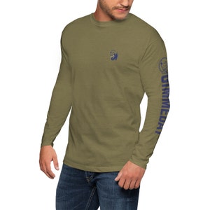 May include: A long-sleeved olive green t-shirt with a blue graphic of a bear on the left chest and the word "UNMEDAI" printed vertically on the right sleeve.