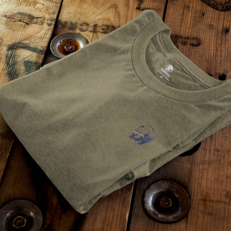 May include: A folded olive green t-shirt with a small blue bison logo on the left chest. The t-shirt is made of a soft, comfortable material.