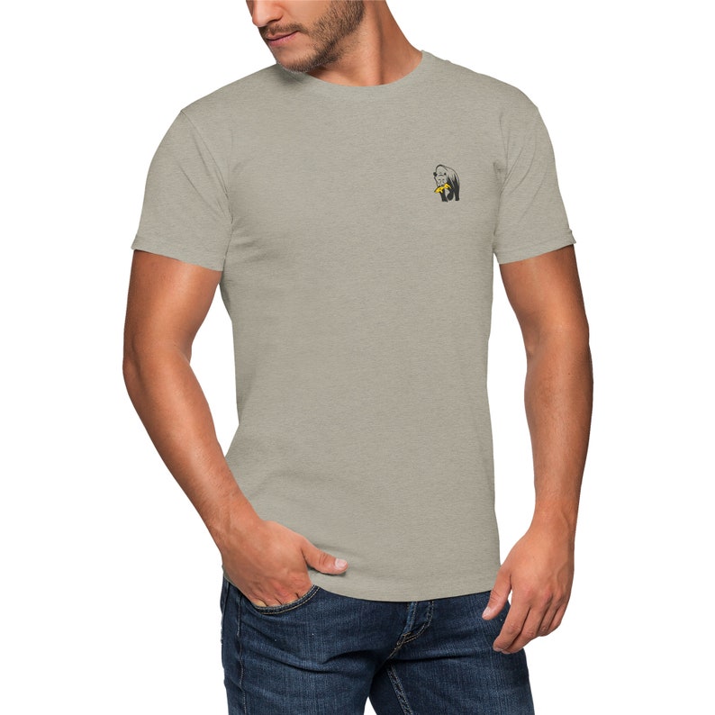 May include: A heather grey t-shirt with a small graphic of a gorilla eating a banana.
