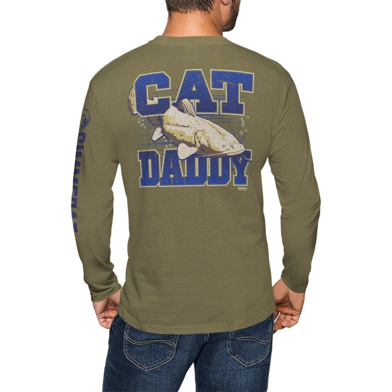 May include: A green long-sleeve t-shirt with a catfish graphic and the text "CAT DADDY" in blue.