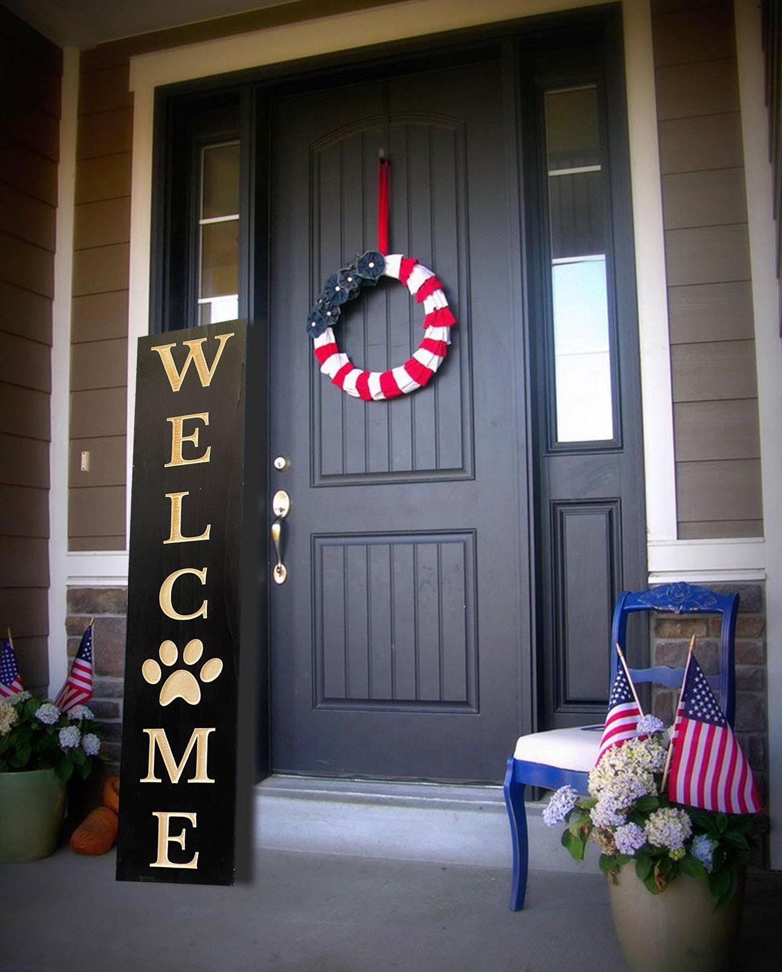 34 Front Porch Decor Ideas for Every Season 4 Dog Paw Welcome Sign: Carved Wood Front Porch Decor