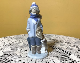 Figura vintage de niño con perro de porcelana Lladró hecha a mano en España