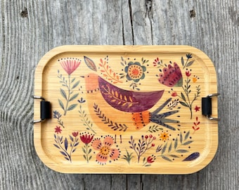 Roestvrijstalen lunchbox met een schattig vogeltje en de mogelijkheid om er een naam op te laten drukken, inclusief een roestvrijstalen tussenschot.