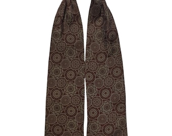 May include: A brown silk necktie with a pattern of beige circles.