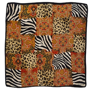 May include: A square silk scarf with a patchwork design featuring zebra stripes, leopard print, and paisley patterns in shades of red, orange, yellow, green, and black. The scarf has a black border and the text "CODELLO" is printed in the bottom right corner.