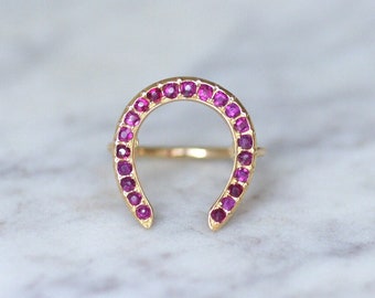 Old yellow gold and ruby horseshoe ring