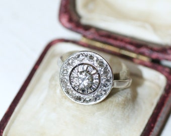 Round Art Deco diamond target ring in gold and platinum