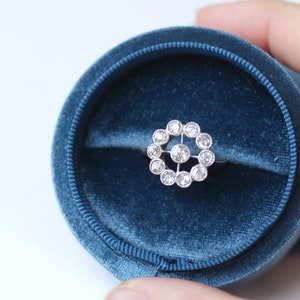 Antique gold, platinum and diamond daisy engagement ring