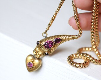 Old snake pendant necklace in yellow gold and garnet