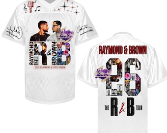 May include: White jersey with a V-neck collar featuring the text "RAYMOND & BROWN" and images of Usher Raymond and Chris Brown. The front has the text "R & B" and the back has the number "26" with "THE R&B TOUR".