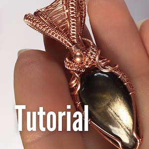 May include: A copper wire wrapped pendant with a dark gray gemstone. The pendant has a woven design and a small copper bead at the top. The word "Tutorial" is visible in the image.