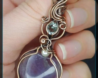 Amethyst heart-shaped gemstone pendant with green amethyst accent stone in antique copper. Unique Jewellery.