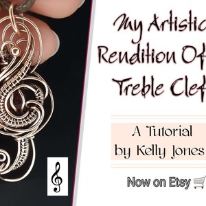 May include: A wire-wrapped treble clef pendant with a red gemstone in the center. The pendant is made of copper wire and is a beautiful example of wire wrapping jewelry.