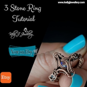 May include: A copper wire wrapped ring with three iridescent stones. The ring is on a finger with blue nail polish. The image includes the text "3 Stone Ring Tutorial" and "Now on Etsy".