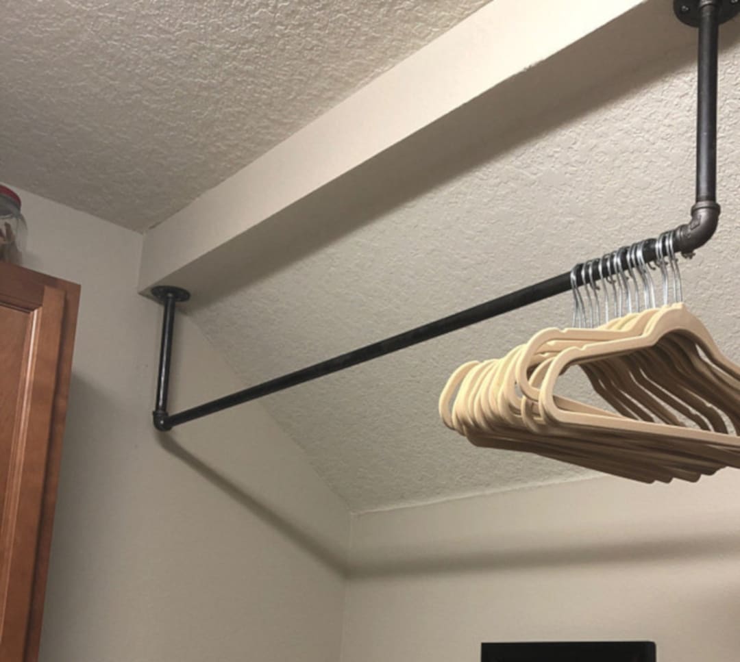 Clothes hanging rod from ceiling sale