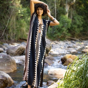 Introducing our ELGA kaftan maxi dress, a stunning piece that combines comfort and style. Made from an ultra-soft, breathable, free-flowing rayon-cotton fabric, this dress is designed to keep you cool and comfortable, no matter the occasion.