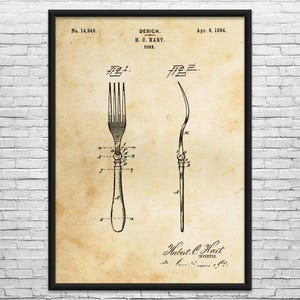 May include: A framed vintage print featuring a fork design patent from April 8, 1884, by H.C. Hart. The black and white illustration shows two views of the fork, with detailed annotations. The print includes the inventor's name and patent number.