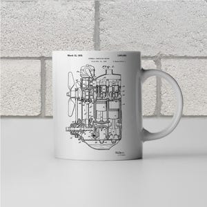May include: Black and white line drawing of an internal combustion engine patent. The patent is titled "Internal Combustion Engine" and was filed on Nov. 22, 1900. The patent number is 1,903,982. The patent was issued on March 12, 1933.