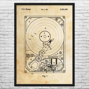 May include: Black framed print of a hard drive patent diagram. The diagram is in black ink on a beige background. The text "U.S. Patent" and "Mar. 1, 1994" are visible at the top. The patent number is 5,291,355. The diagram is labeled "Fig. 1".