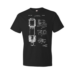 May include: Black t-shirt with a white graphic of a patent drawing for a "Vacuum Tube for the Air Cooled" device. The patent number is 2,704,448 and the date is July 10, 1956.