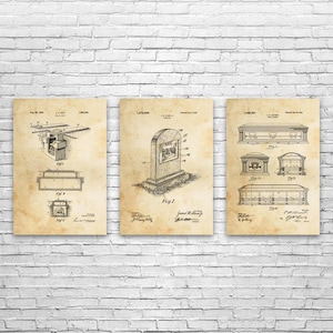 May include: Three vintage-style prints on aged paper, each featuring detailed technical drawings. The prints depict various designs, including a burial vault, a tombstone, and a casket. The drawings are in black ink.
