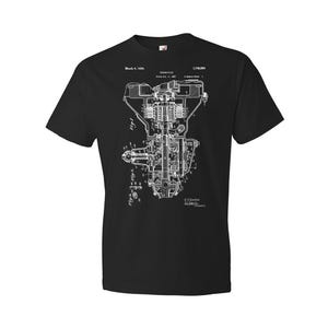 May include: Black t-shirt with a white print of a vintage engine patent drawing. The patent number is 1,749,000 and the date is March 4, 1930.