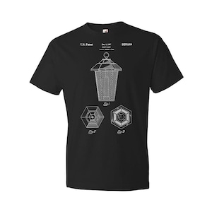 May include: Black t-shirt with a white print of a patent drawing for a lantern. The drawing shows a lantern with a square base and a round top. The text on the shirt reads "U.S. Patent Dec. 4, 1997 D293,014".