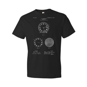 May include: Black t-shirt with a white print of a clock patent design. The patent is for a "Clock and Time Piece" and was patented on Nov. 17, 1885. The patent number is 331,500.
