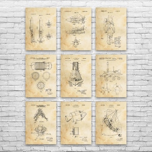 May include: Nine vintage-style prints featuring space-related patent illustrations. The prints showcase detailed diagrams of rockets, spacecraft, and astronaut equipment. The artwork is in black ink on a parchment-like background, creating a retro aesthetic.