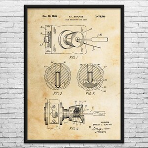 May include: A framed vintage patent print of a lock mechanism, dated November 18, 1969, with detailed diagrams and the text "E.L. Schlage Pick Resistant Lock Unit." The print features technical drawings and labels, showcasing the lock's internal components.
