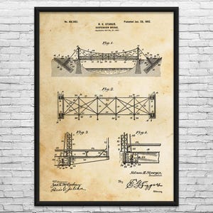 May include: Framed vintage patent print of a suspension bridge, dated January 28, 1902, by N.H. Sturgis. The sepia-toned blueprint features detailed technical drawings of the bridge's structure, including various views and cross-sections. The print is in a black frame.