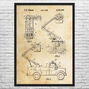 May include: A framed print of a U.S. patent illustration. The patent drawing depicts a truck with a crane, labeled "FIG. 3", and detailed diagrams of the crane's mechanics, labeled "FIG. 1" and "FIG. 2". The patent date is August 9, 1988.