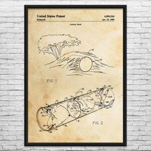 May include: A framed vintage patent print for an animal trap, dated April 22, 1986. The print features two detailed diagrams of the trap design, with the words "United States Patent" at the top.