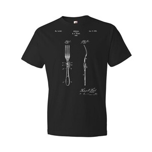 May include: Black t-shirt with a white print of a vintage patent design for a fork. The patent number is 14,848 and the date is April 8, 1884. The text reads "Design, H.C. Hart, New York".