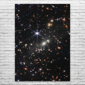 May include: A vibrant image of deep space, showcasing countless galaxies and stars against a dark backdrop. Bright, multi-pointed stars and clusters of galaxies dominate the scene, creating a sense of vastness and wonder. The image is a stunning representation of the cosmos.