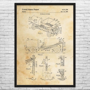 May include: Patent print of a pothole patching machine, dated April 16, 1985. The black and white technical drawing shows the machine's components and design, including a tank, hopper, and various mechanical parts. The print is framed in black.